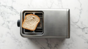 what does defrost setting do on a toaster