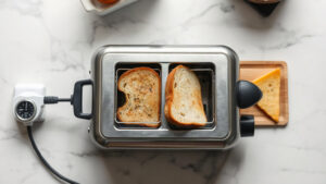 how many watts does a 2-slice toaster use on light toast setting vs dark